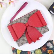 Gucci Childrens GG Supreme bow wristlet red 